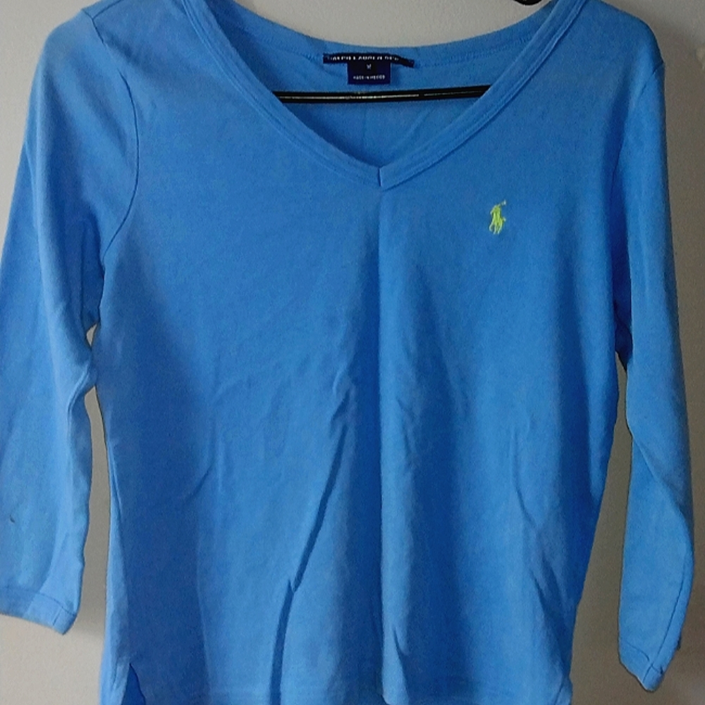 A polo blue long sleeves with a v neck